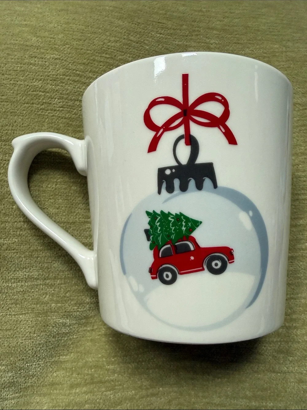 Maude Borup Mug Decorated w/ a Christmas Tree Atop a Red Car in a Round Ornament